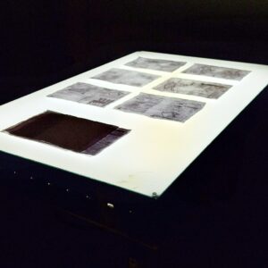 Elena Marini, 𝘓𝘜𝘟 100𝘹150, 2025, tavolo luminoso, pagine di manuale di uso e manutenzione.
