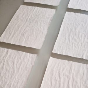 Elena Marini, 𝘓𝘜𝘟 100𝘹150, 2025, tavolo luminoso, pagine di manuale di uso e manutenzione.